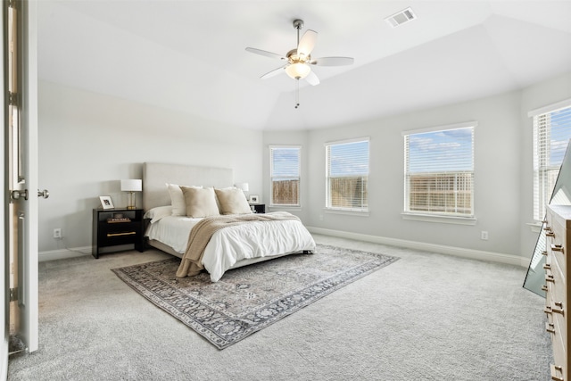 carpeted bedroom with vaulted ceiling and ceiling fan