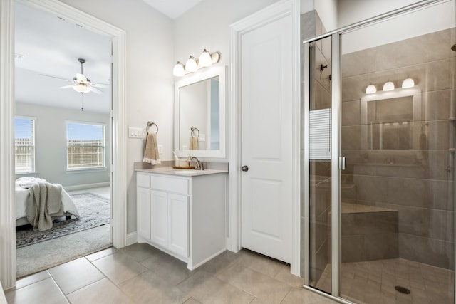 bathroom featuring ceiling fan, tile patterned floors, vanity, and a shower with shower door