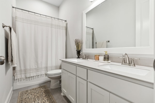 full bathroom featuring vanity, tile patterned floors, toilet, and shower / bath combo