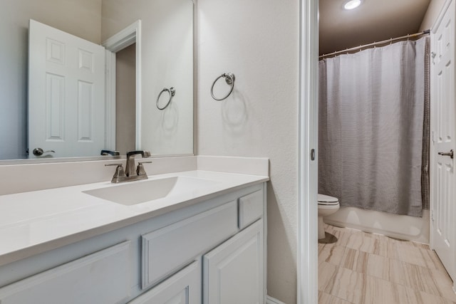 full bathroom with vanity, toilet, and shower / tub combo