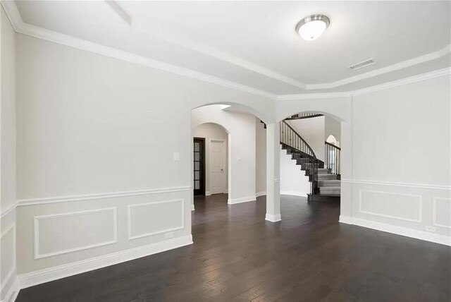 interior space featuring dark hardwood / wood-style flooring and ornamental molding