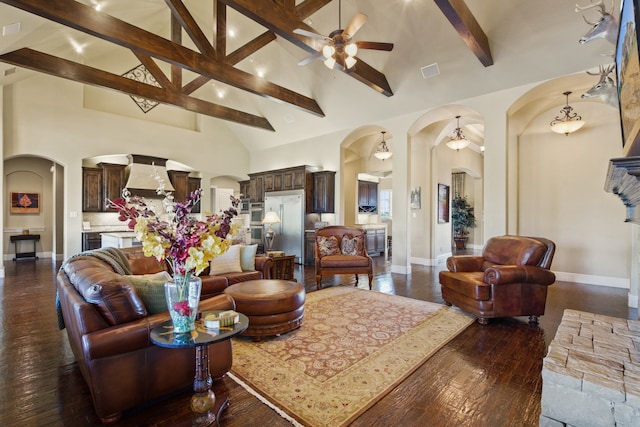 living room with beam ceiling, high vaulted ceiling, dark hardwood / wood-style flooring, and ceiling fan