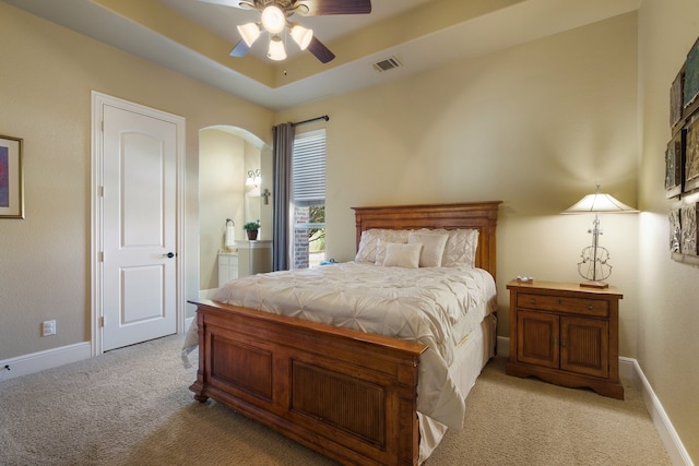 bedroom with light colored carpet and ceiling fan