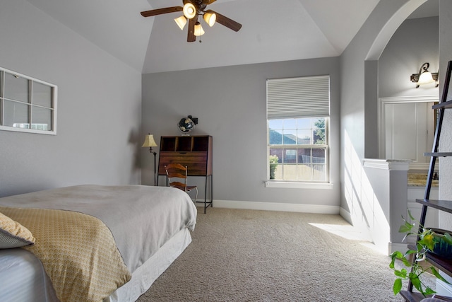 carpeted bedroom with ceiling fan and lofted ceiling