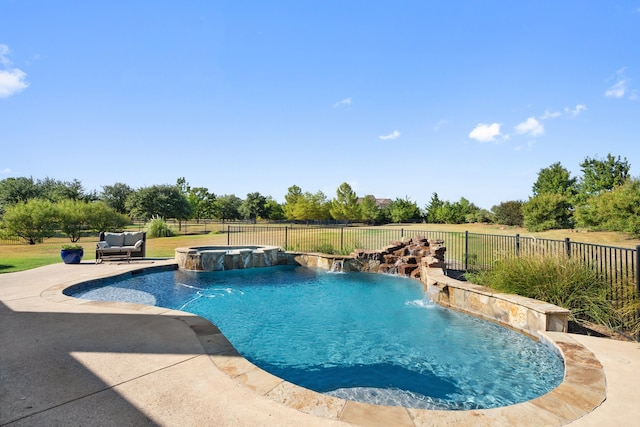 view of pool featuring an in ground hot tub, a patio, and pool water feature