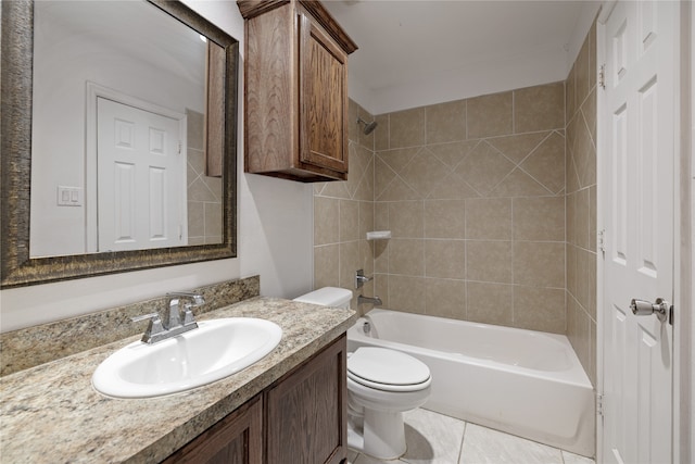 full bathroom with tiled shower / bath combo, vanity, toilet, and tile patterned floors