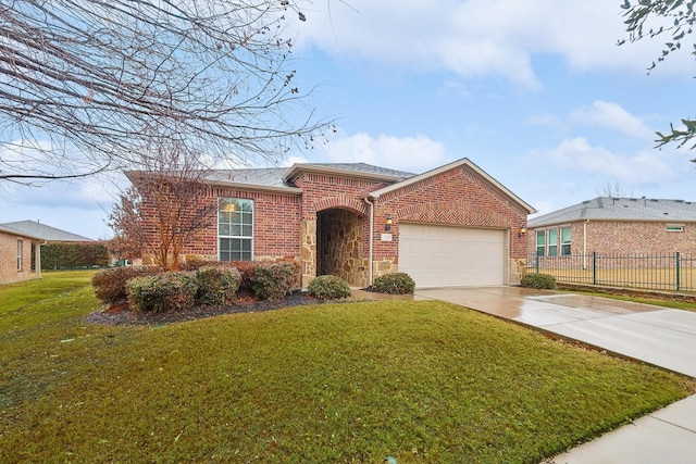 ranch-style house featuring a garage and a front yard