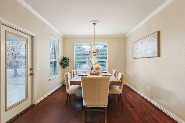 dining area with dark wood-type flooring, ornamental molding, and an inviting chandelier