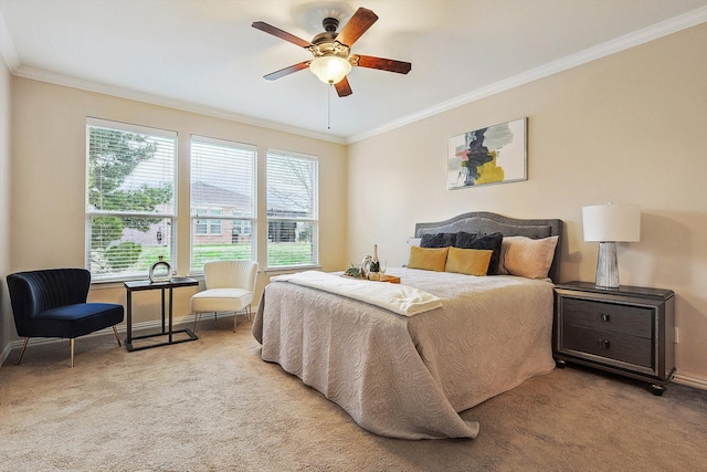 bedroom featuring crown molding, light colored carpet, and ceiling fan