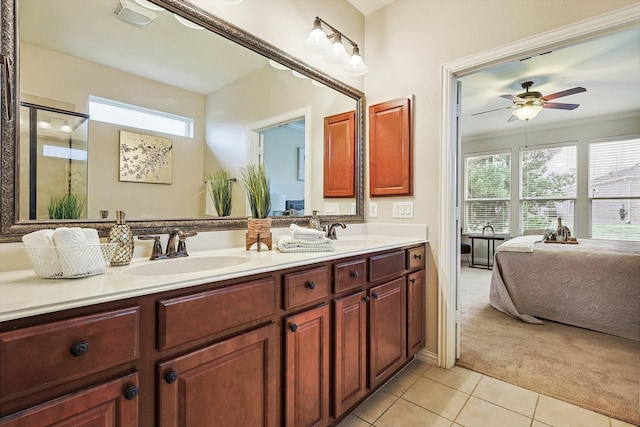 bathroom with crown molding, vanity, ceiling fan, and tile patterned floors