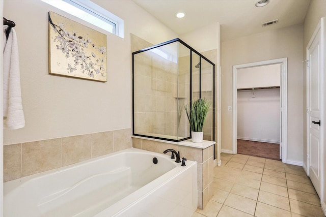 bathroom featuring tile patterned flooring and plus walk in shower