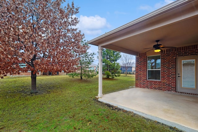 view of yard featuring ceiling fan and a patio area