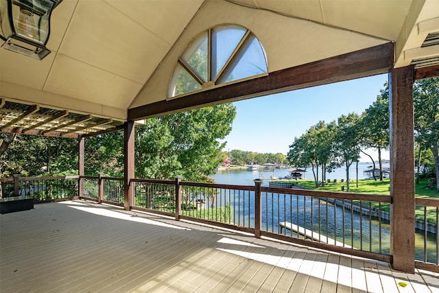 wooden terrace featuring a water view