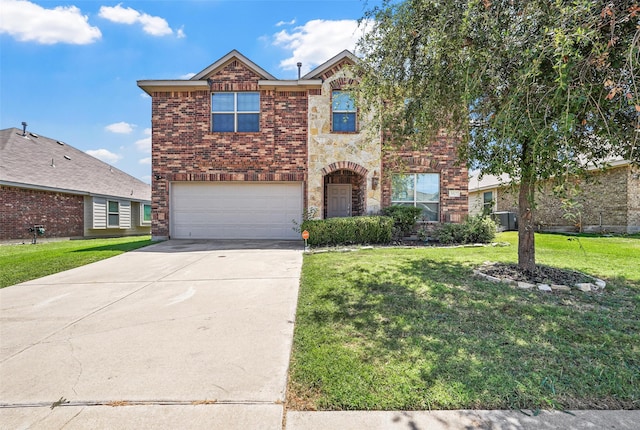 view of property with a garage and a front yard