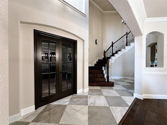 1424 Palestine Dr, Prosper, TX 75078 - entryway with arched walkways, stairway, french doors, and crown molding