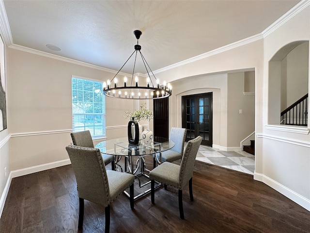 dining room with crown molding, a chandelier, and hardwood / wood-style floors