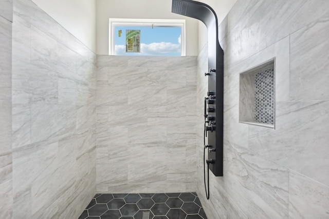 bathroom with tiled shower