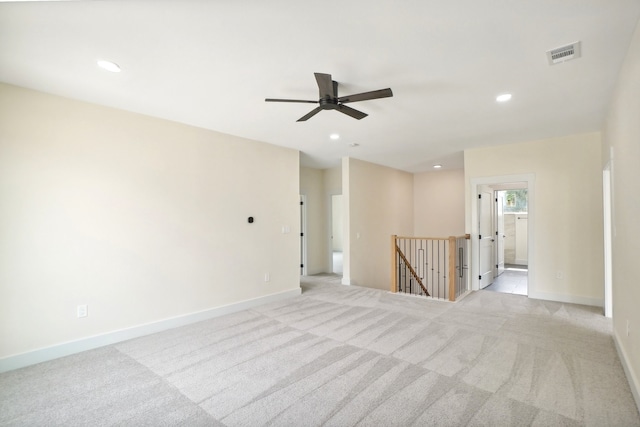 carpeted empty room with ceiling fan