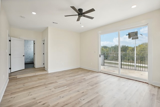 unfurnished room featuring light wood-type flooring and ceiling fan