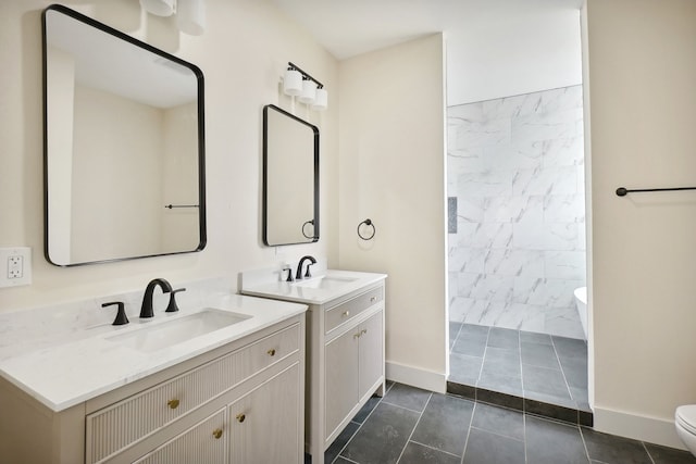 bathroom featuring tile patterned floors, vanity, and toilet