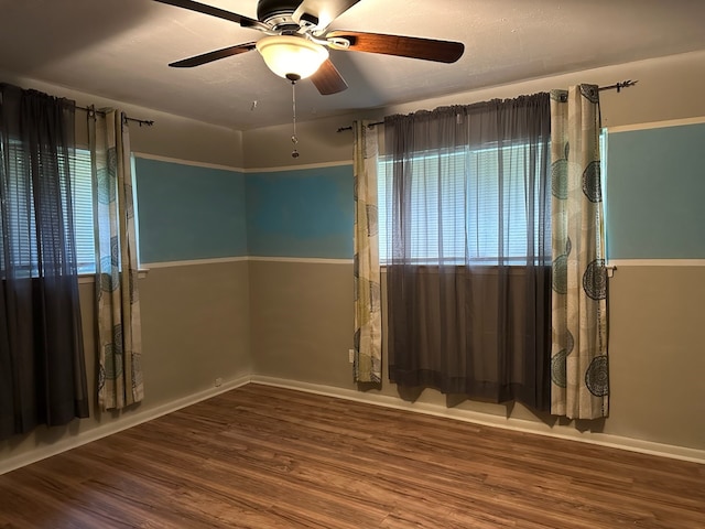 unfurnished room featuring wood-type flooring and ceiling fan