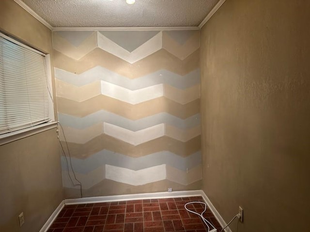 bathroom featuring brick floor, baseboards, a textured ceiling, and crown molding