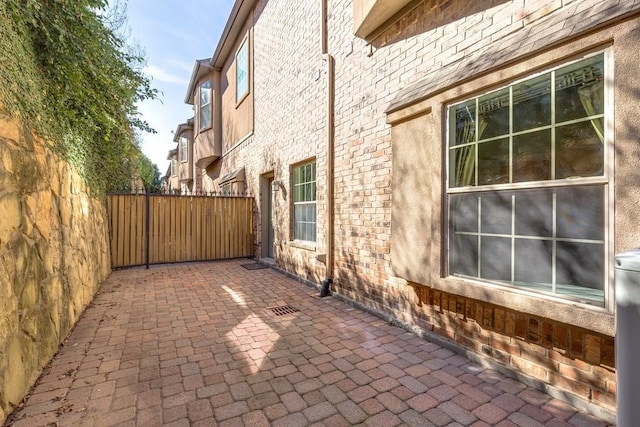 view of side of home featuring a patio area