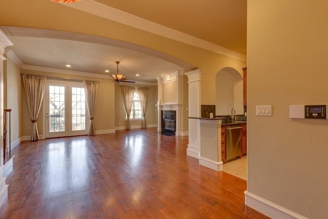 kitchen featuring french doors, light hardwood / wood-style flooring, stainless steel dishwasher, and white cabinets