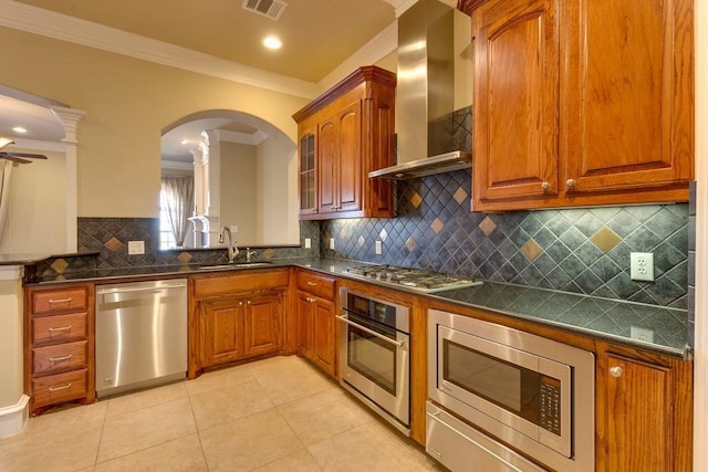 kitchen with backsplash, crown molding, stainless steel appliances, sink, and wall chimney exhaust hood