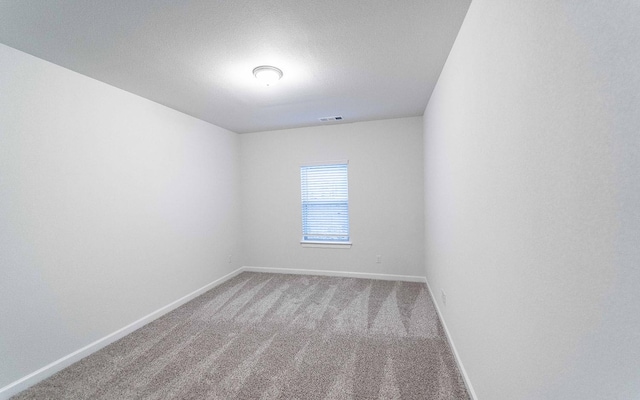 spare room with carpet floors