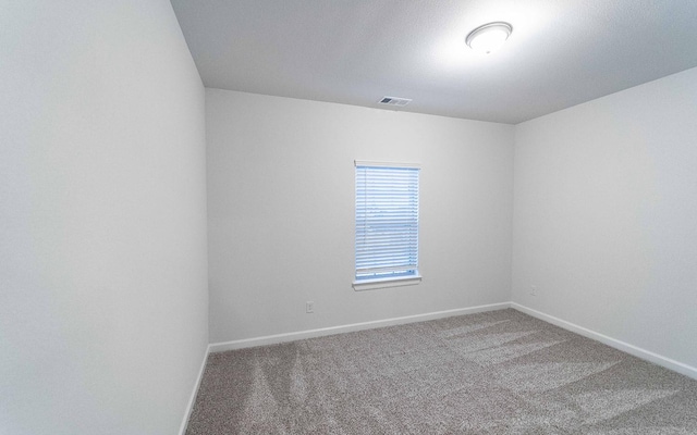 unfurnished room with carpet floors