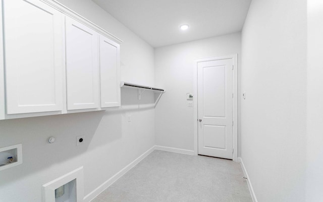 clothes washing area featuring electric dryer hookup, gas dryer hookup, hookup for a washing machine, and cabinets