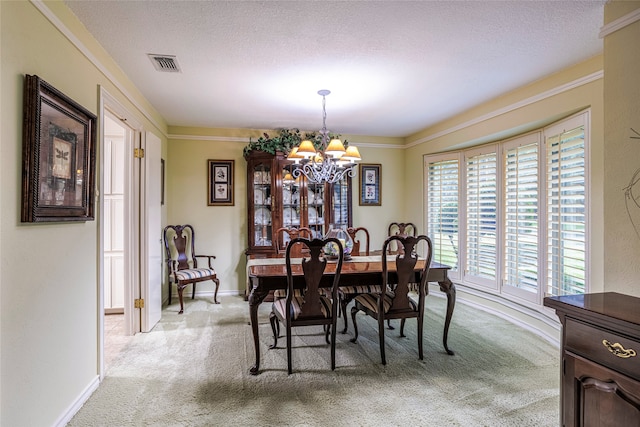 dining area with a notable chandelier, a textured ceiling, light carpet, and a healthy amount of sunlight