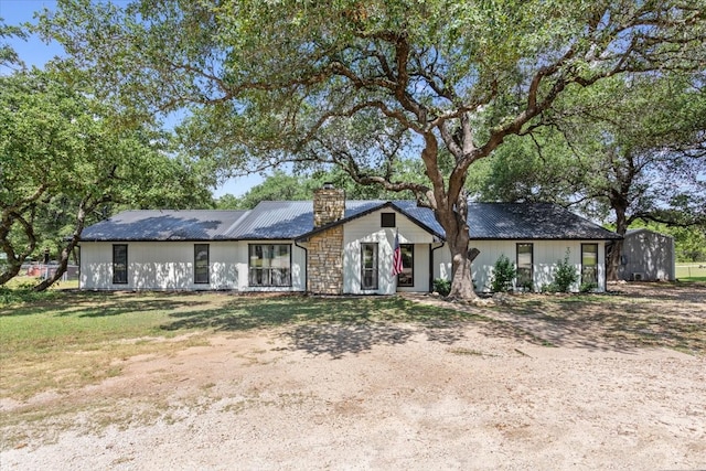 single story home with a storage unit