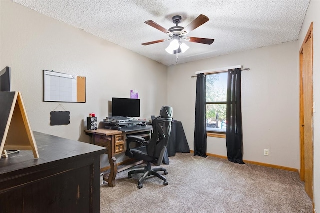 office featuring a textured ceiling, ceiling fan, and carpet floors