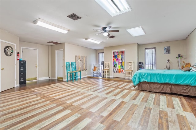 unfurnished bedroom featuring hardwood / wood-style floors and ceiling fan