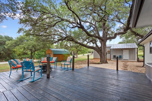 wooden terrace with a storage unit