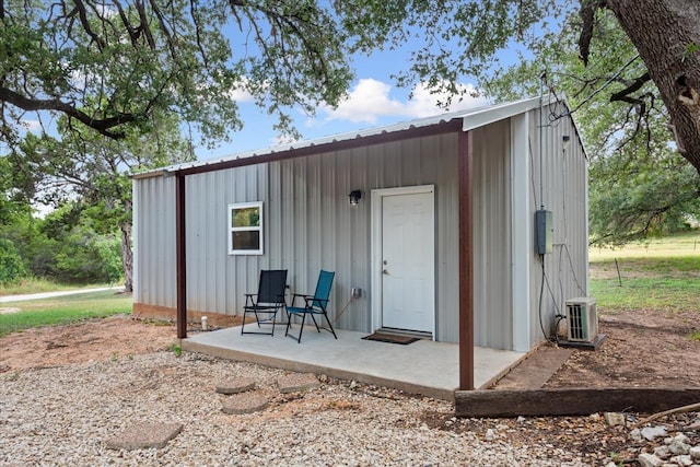 view of outbuilding featuring cooling unit