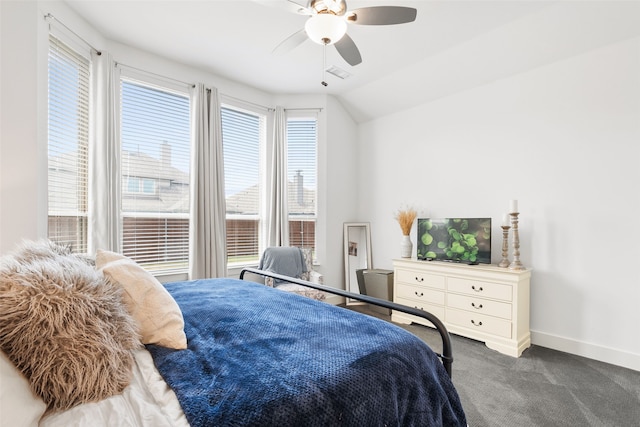 carpeted bedroom with lofted ceiling, multiple windows, and ceiling fan