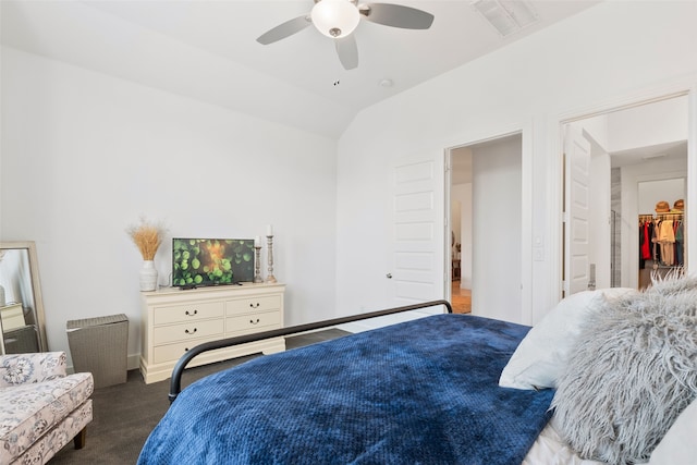 bedroom with lofted ceiling, ceiling fan, and carpet floors