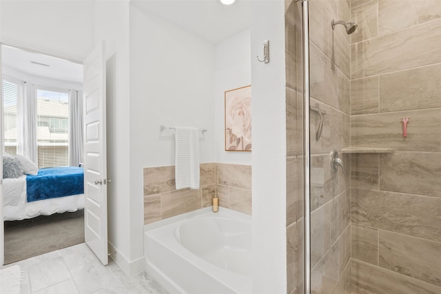 bathroom featuring separate shower and tub