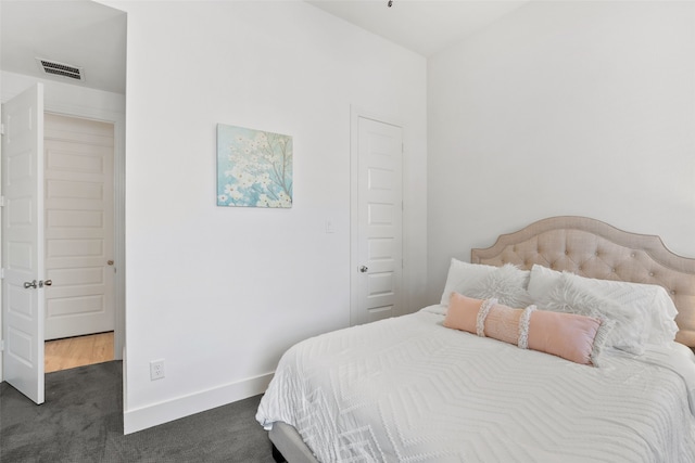 carpeted bedroom with a closet