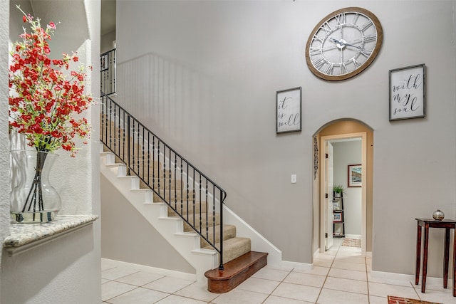 staircase with tile patterned flooring