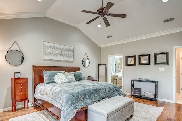 bedroom featuring ensuite bathroom, crown molding, ceiling fan, and vaulted ceiling