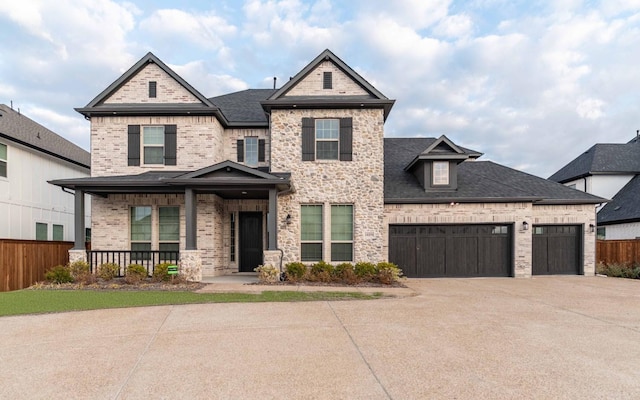 view of front of home with a garage and a porch