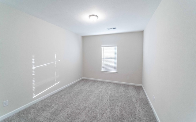 unfurnished room featuring carpet floors