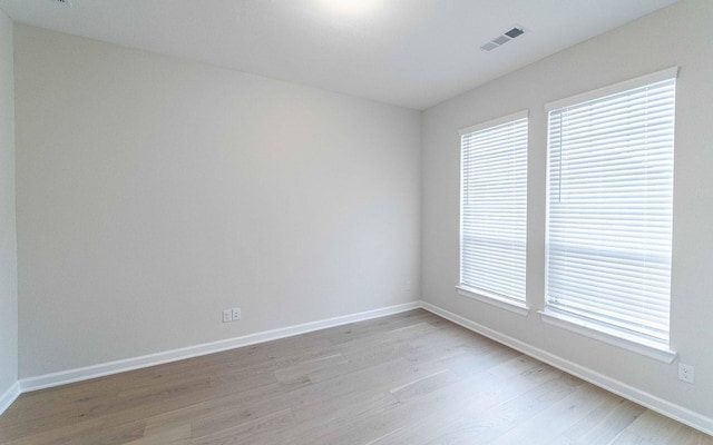 spare room with light wood-type flooring