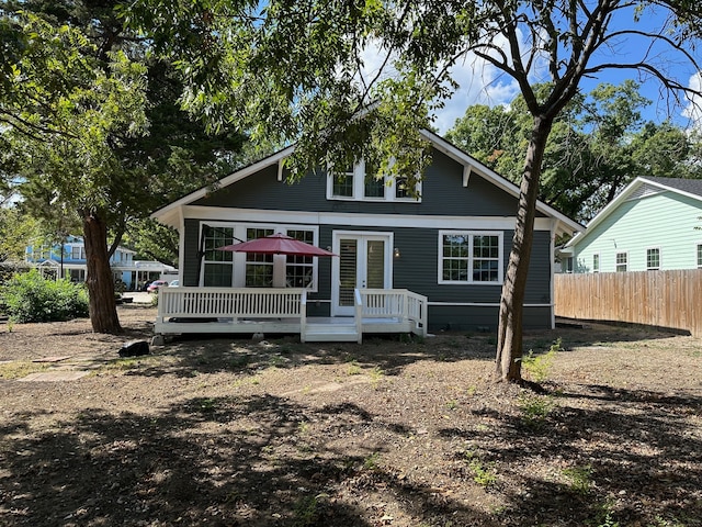 rear view of house with a wooden deck