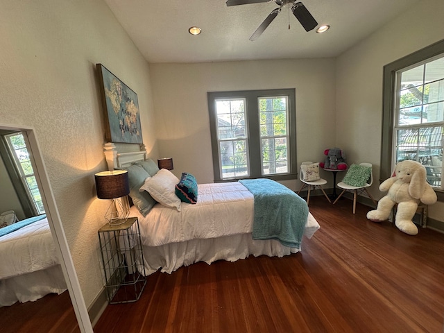 bedroom with ceiling fan and hardwood / wood-style floors