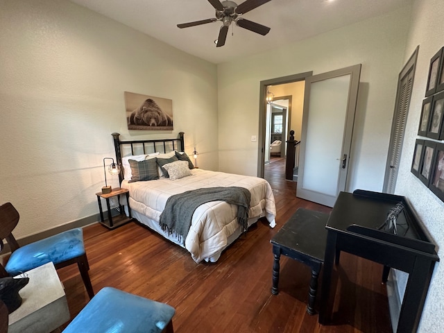 bedroom with ceiling fan and dark hardwood / wood-style floors